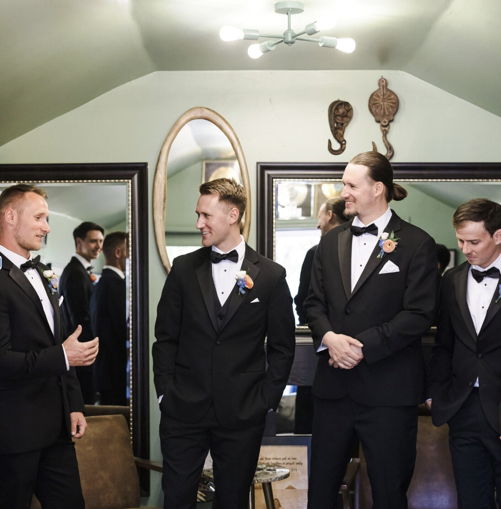 Groomsmen getting ready together in the Green Room