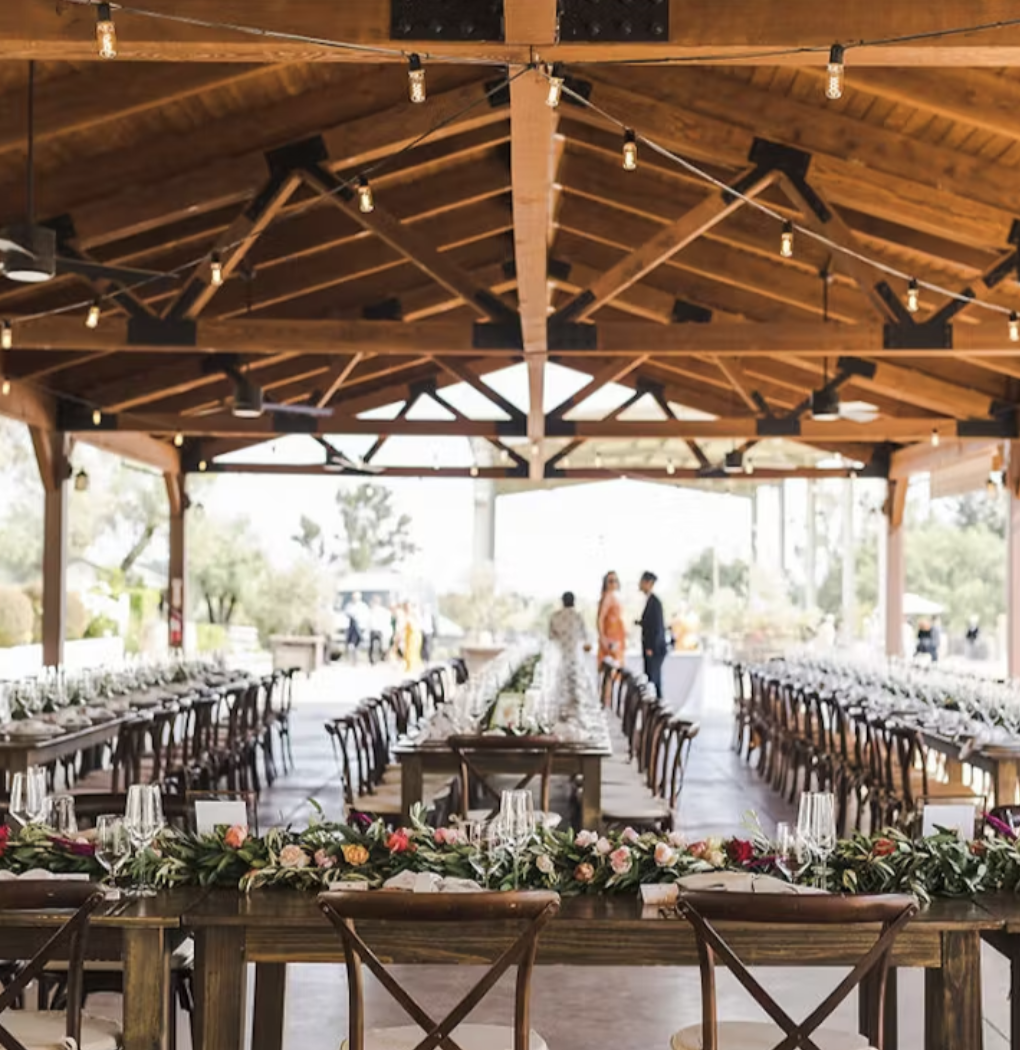 Wide interior view of the Vineyard Pavilion set for a wedding reception
