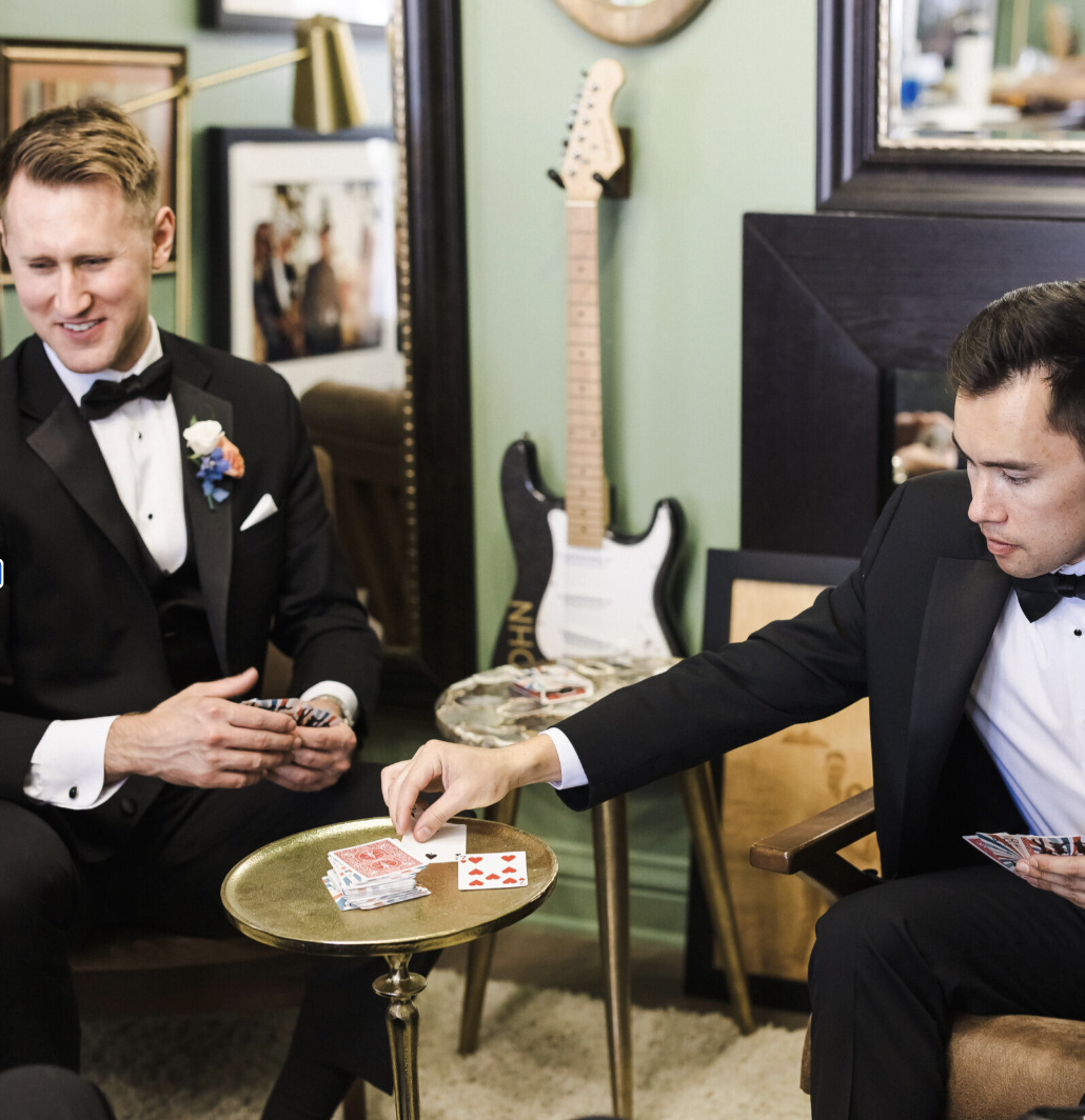 Groomsmen playing cards in the Green Room before the ceremony